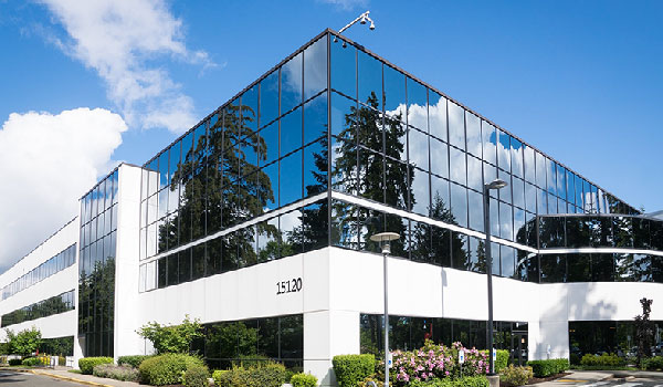 white commercial building with lots of windows