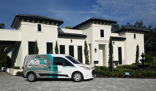 large white house with nicely manicured lawn